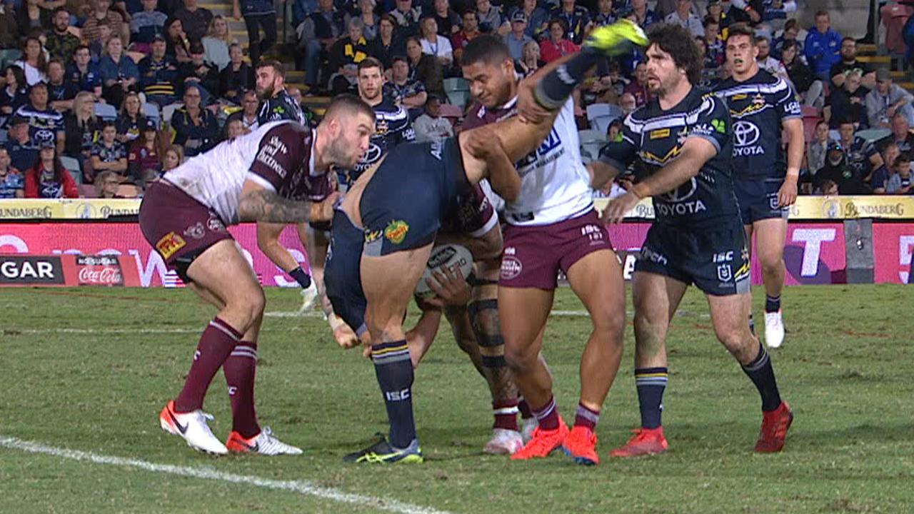 Manase Fainu performs a suspect tackle on Jordan McLean.