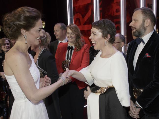 Kate, Duchess of Cambridge meets Olivia Colman, and director Yorgas Lanthimos, 2nd right, and writer Tony McNamara, right, after the BAFTA 2019 Awards at The Royal Albert Hall in London, Sunday Feb. 10, 2019. (AP Photo/Tim Ireland, Pool)