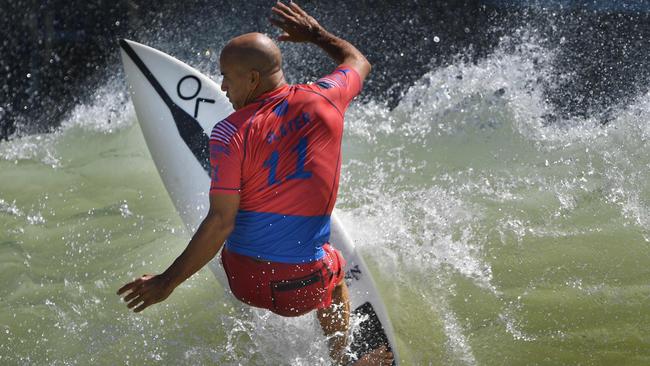 TOPSHOT - US' Kelly Slater surfs off the lip during the qualifying round of the WSL Surf Ranch Pro, at the Kelly Slater Surf Ranch in Lemoore, California on September 8, 2018. - The four-day event brings the worlds top surfers to compete on perfect machine-created waves in a half-mile long (.8kms) wave pool situated 100 miles (160.9kms) inland from the Pacific Ocean. (Photo by Mark RALSTON / AFP)