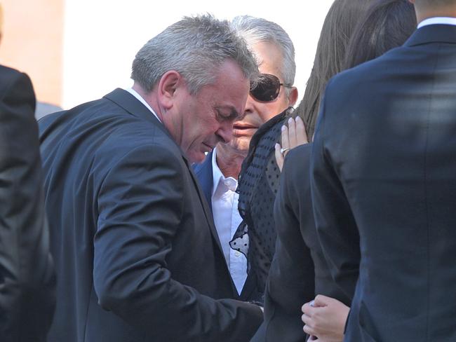 Mr Ristevski after leaving the church as his wife’s coffin is placed in the hearse for a private burial ceremony. Picture: AAP