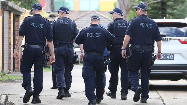 Police return to the Auburn Road crime scene on Tuesday. Picture: John Grainger