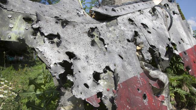 Military experts say the damage to this piece of the plane points to the use of the SA-11 Buk. AP Photo