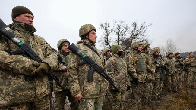 Reservists of the Ukrainian Territorial Defence Forces line up during military exercises at a training ground outside Kharkiv, Ukraine December 11, 2021.