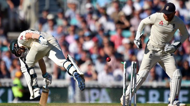 Steve Smith, left, narrowly avoids being run out by England's Jonny Bairstow during play on the second day of the fifth Ashes test. Picture: Glyn Kirk/AFP