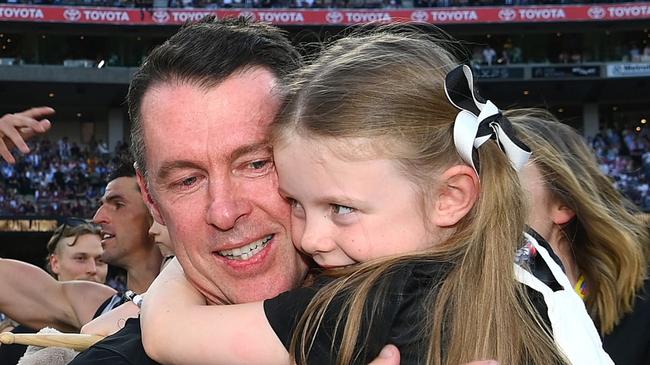 MELBOURNE, AUSTRALIA - SEPTEMBER 30: Jordan De Goey of the Magpies and Craig McRae, Senior Coach of the Magpies celebrates winning the premiership during the 2023 AFL Grand Final match between Collingwood Magpies and Brisbane Lions at Melbourne Cricket Ground, on September 30, 2023, in Melbourne, Australia. (Photo by Quinn Rooney/Getty Images)