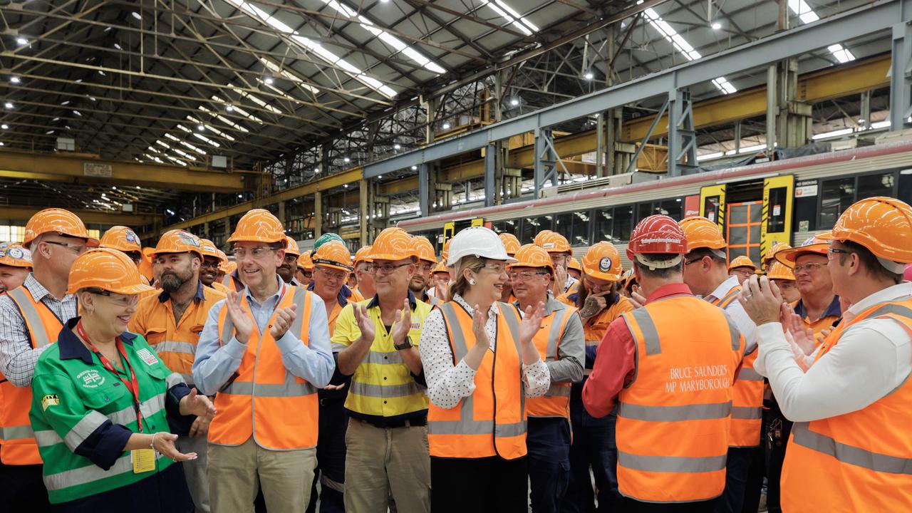 Cameron Dick, Annastacia Palaszczuk, Bruce Saunders and Steven Miles celebrate the announcement with Downer employees at Maryborough. Picture Lachie Millard