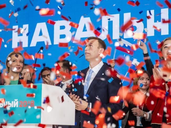 "Confetti" Alexei Navalny, his wife Yulia (on the left) and daughter Darya (on the right) react as they see confetti being released at a formal gathering to nominate Alexey to run for president. December 24, 2017 Picture - Evgeny Feldman