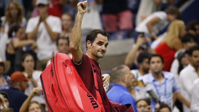 Roger Federer waves to the crowd as he leaves the court after losing to John Millman. Picture: AP.