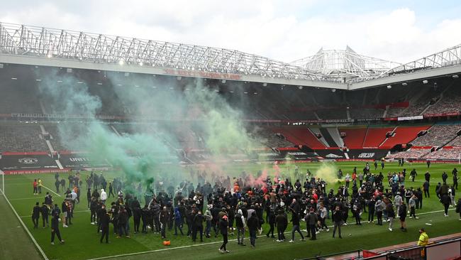 Supporters protest against Manchester United’s owners inside Old Trafford Stadium overnight (AEST). Picture: AFP