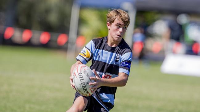 Day One of King of the Country rugby tournament at James Overell Park, Southport. Maroochydore Swans U14s' ( big stripes - blue) in action against USQ Saints U14s' (darker blue small stripes). Maroochydore Swans U14s Brock Combes . Picture: Jerad Williams