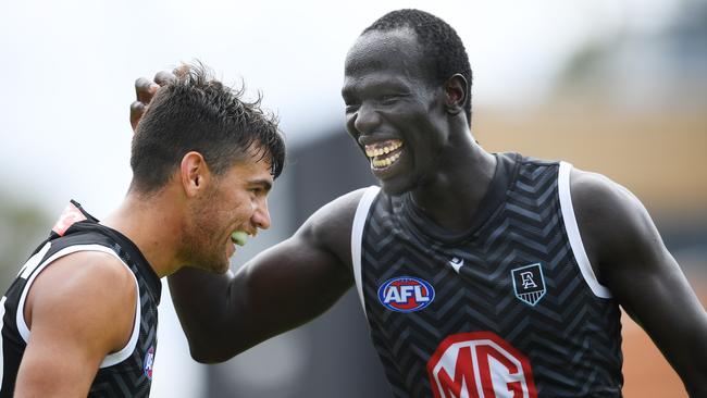 Aliir Aliir and Riley Bonner share a laugh on the three-quarter-time siren.