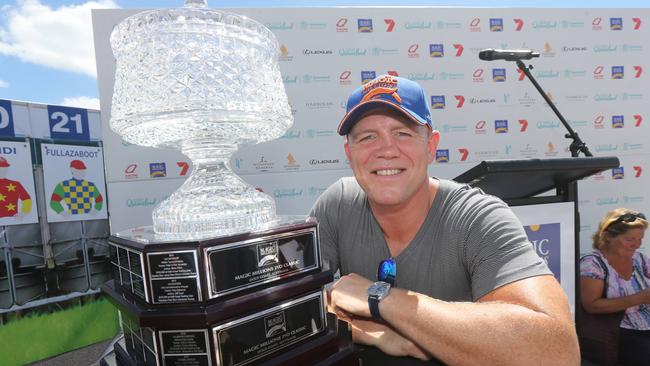 Pictured on Surfers Paradise Beach for the Magic Millions Barrier Draw is Mike Tindall and the Magic Millions Two Year Old Classic trophy. Picture Mike Batterham