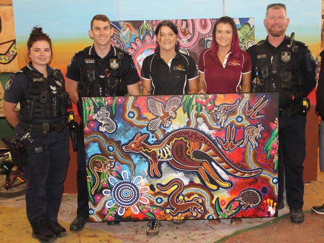 With the assistance of local elders, police and high school students, Chern'ee and Brooke Sutton created two special paintings.