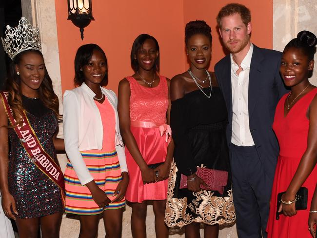 Harry gets all the tough jobs on tour. Chatting to Miss Antigua and Island Beauty Queens at the reception hosted by Gaston Browne, Prime Minister of Antigua and Barbuda. Picture: Paul Edwards/WPA Pool/Getty Images