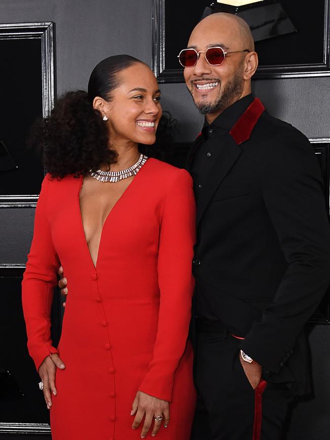 Host US singer-songwriter Alicia Keys and husband rapper Swizz Beatz smile at the Grammys. Picture: Getty