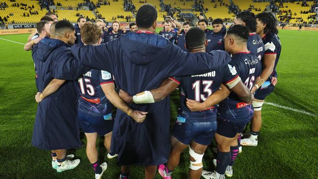 Rebels players form a huddle after they lost to the Hurricanes their final game as a team after being axed by Rugby Australia. Picture: Hagen Hopkins/Getty Images