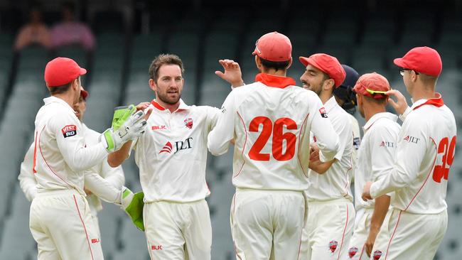 Redbacks’ Chadd Sayers celebrates after removing Sean Abbott on his way to picking up 250 first-class wickets. Picture: AAP Image/David Mariuz