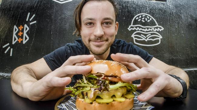 Bread &amp; Bone chef Joel Stephens with one of SA’s best burgers. Picture: Roy VanDerVegt