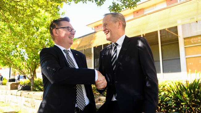 Brian Owler, left, shaking hands with Bill Shorten yesterday outside Ryde Hospital in Sydney’s north. Picture: AAP