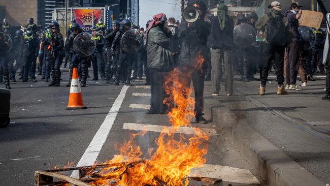 Protesters attempt to establish a barricade on Melbourne’s Clarendon Street Bridge during the Land Forces protest in September. Picture: Jake Nowakowski