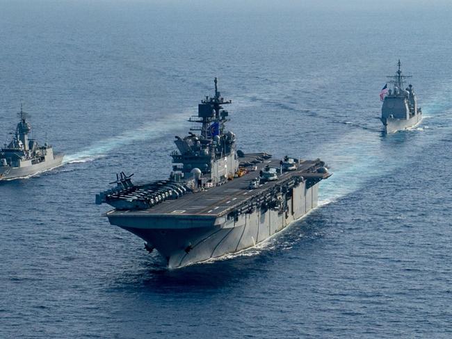 (L-R) Royal Australian Navy helicopter frigate HMAS Parramatta conducts officer of the watch manoeuvres with amphibious assault ship USS America, guided-missile cruiser USS Bunker Hill and guided-missile destroyer USS Barry in the South China Sea. *** Local Caption *** Royal Australian Navy Anzac class frigate HMAS Parramatta and her crew of 190 officers and sailors departed Fleet Base East in February for a deployment to South East Asia.  The deployment is a valuable opportunity to build relationships with Australia's regional partners and demonstrate the professionalism and capability of Navy and its people. Picture: Department of Defence