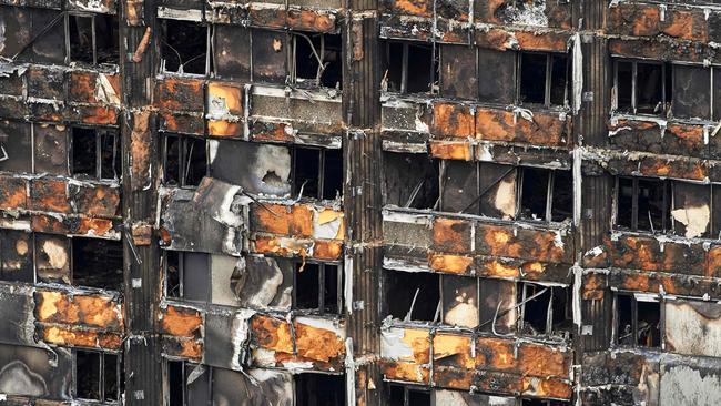 The charred remains of cladding are pictured on the outer walls of the burnt out shell of the Grenfell Tower block in north Kensington, west London.