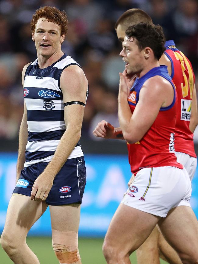 Lachie Neale holds his jaw as Gary Rohan looks on. Picture: Michael Klein