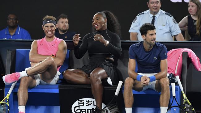 (FILES) In this file photo Serena Williams of the US (C) shares a lighter moment with Rafael Nadal of Spain (L) and Novak Djokovic of Serbia (R) as they and other top players play in the Rally for Relief charity tennis match in support of the victims of the Australian bushfires, in Melbourne of January 15, 2020, ahead of the Australian Open tennis tournament. - Top-ranked Novak Djokovic and world number two Rafael Nadal have entered the US Open tuneup tournament to be played in New York while Serena Williams is in the women's field. Organizers of the ATP and WTA Western and Southern Open, typically played in Cincinnati but moved to New York this year due to the coronavirus pandemic, announced initial singles entry lists on July 29, 2020. (Photo by WILLIAM WEST / AFP) / -- IMAGE RESTRICTED TO EDITORIAL USE - STRICTLY NO COMMERCIAL USE --