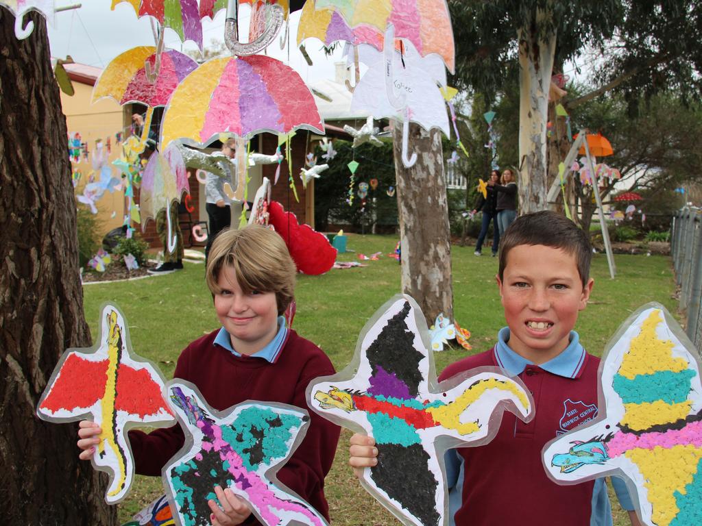 Year 5 boys Dusty Gibbs and Blake Weier with their carefully crafted dragons for the Central State School Jumpers and Jazz in July display. Photo: Erin Smith / Warwick Daily News