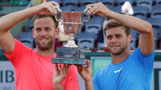 Michael Venus and Ryan Harrison celebrate their doubles title win.