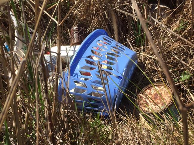 Rusting paint tins and old oil and chemical containers by the side of Booralie Rd, Terrey Hills. Picture: Supplied