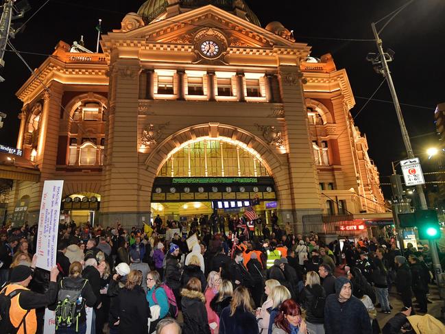 Protesters gather at Flinders Street Station to protest the 7 day Covid 19 lockdown. Picture: Jason Edwards