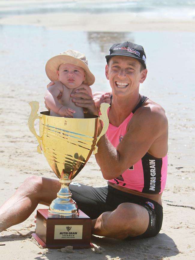 Ali Day celebrates his Nutri-Grain Ironman Series victory with son Danny. Photo: HarvPix