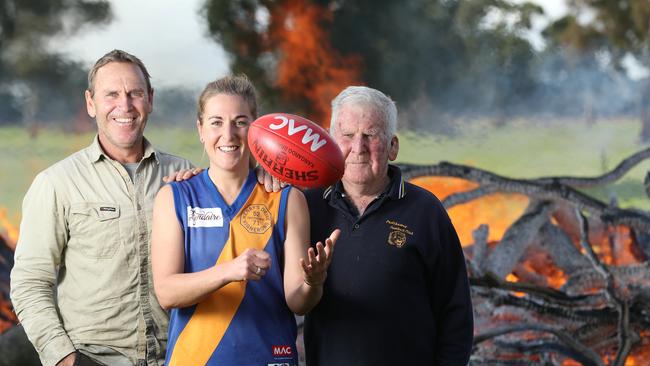 Casey McElroy, 27, on the family farm at Marcollat with her dad Bradley and grandfather Jeffrey. Picture: TAIT SCHMAAL