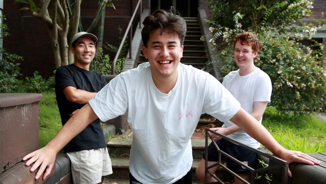 Left to right: Daichi Ito, 21, Harry Chung, 22, and Dan McHugh, 21, at their Randwick home today. Picture Jeff Darmanin