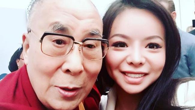 Human rights Anastasia Lin with the Dalai Lama. She is in Australia to promote a documentary about Chinese influence in our affairs. (Pic: Supplied)