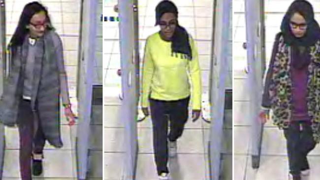 (L-R) British teenagers Kadiza Sultana, Amira Abase and Shamima Begum passing through security barriers at Gatwick Airport, south of London, on February 17, 2015. 