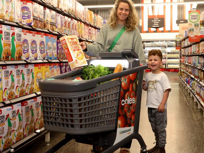 *EDITORIAL USE ONLY* Melbourne mum Rebecca Karo with son Imri with the Coles Smart Trolley. Picture: NewsWire Handout