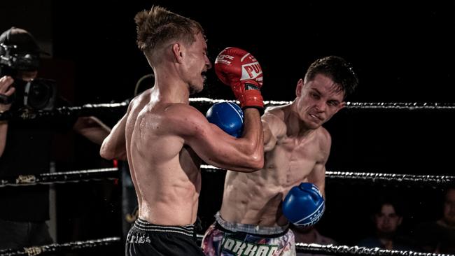 Matty Clarke lands a strong punch on Jesse Clarke's chin. Picture: Emily Barker