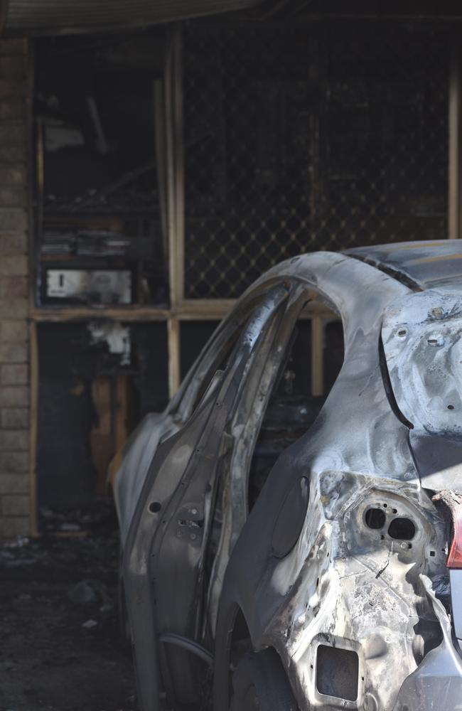 The vehicles in the carport were completely torched and gutted following the fire at Cromwell St.