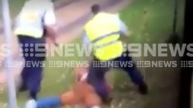 Police arrest the man they have removed from the bus. Picture: 9 News