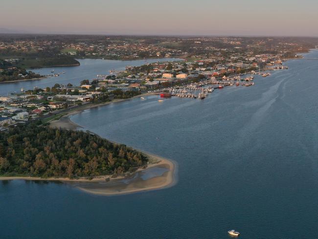 HOLD FOR HERALD SUN PIC DESK----East Gippsland tourism in fire affected areas, in attempts to draw the crowds back to seaside locations and small country towns. Lakes Entranc. An aerial view of Lakes Entrance, at sunset.  Picture: Alex Coppel.