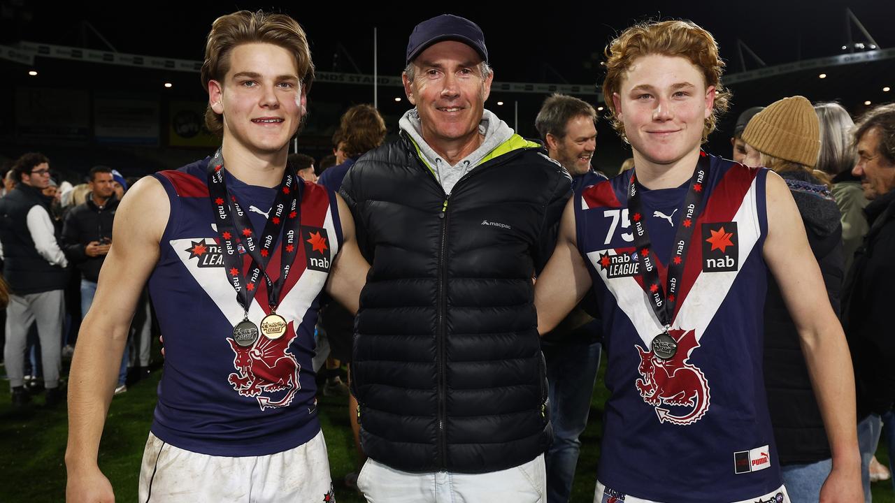 Will Ashcroft (L) and his younger brother Levi Ashcroft (R) with their father, former Brisbane Lions triple premiership player Marcus Ashcroft. (Photo by Daniel Pockett/AFL Photos/via Getty Images)