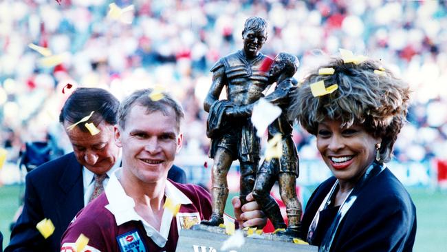 Alfie Langer and Tina Turner holding the Winfield Cup at the end of the 1993 Brisbane Broncos v St George Rugby League Grand Final in Sydney.