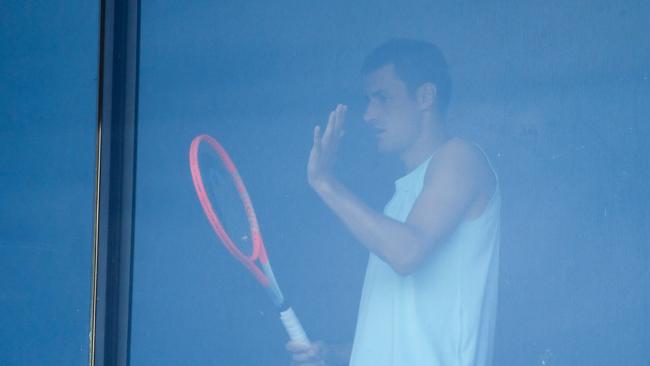 Bernard Tomic exercises in his hotel room in Melbourne during quarantine