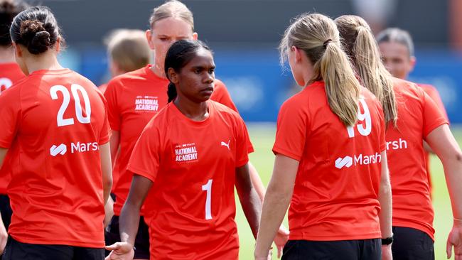 Marika Carlton of the AFL National Academy high fives team mates during the 2025 Marsh AFL National Academy Girls training session at Whitten Oval. Picture: Josh Chadwick/AFL Photos