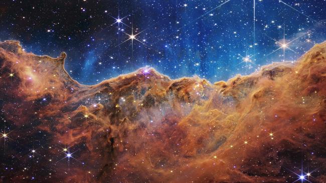 An image from the James Webb Space Telescope (JWST) shows a landscape of the edge of a nearby, young, star-forming region called NGC 3324 in the Carina Nebula. Picture: NASA/AFP