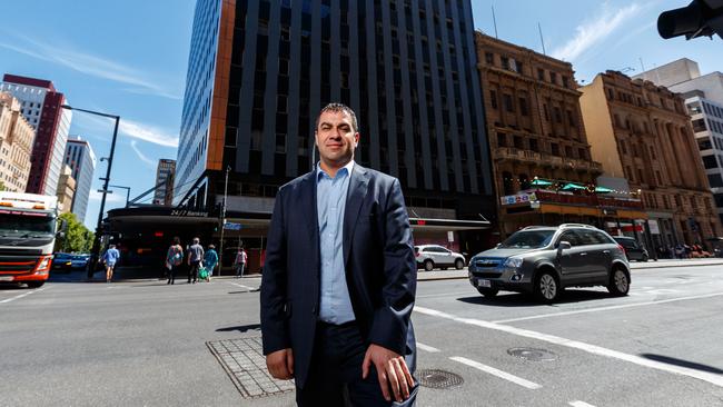 Ross Pelligra in front of the newly purchased office building on the corner of King William and Grenfell streets. Picture: Matt Turner.