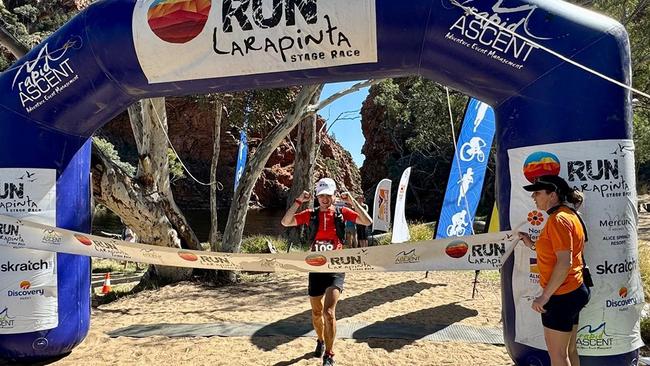 Overall 2024 Run Larapinta Stage Race winner Yun Phua crosses the finish line at Ellery Creek Big Hole. Picture: Forktail