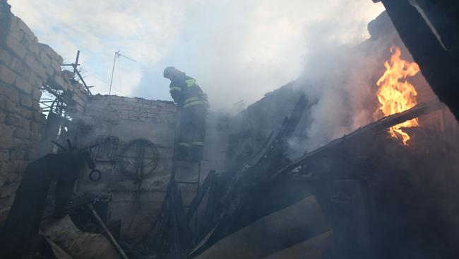 Firefighters work in a destroyed building hit by recent shelling in a residential area in Donetsk. Picture: AFP